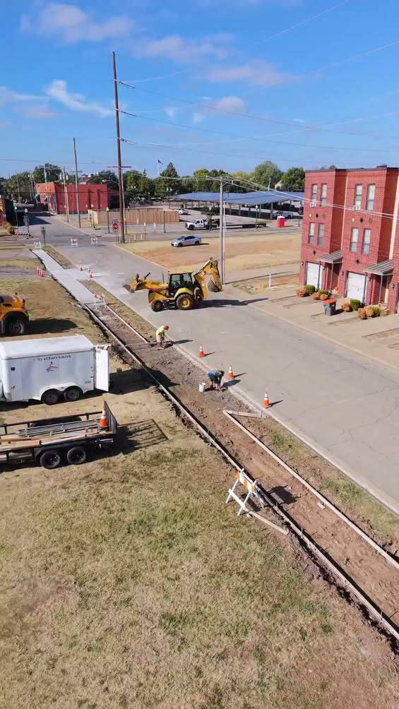 Construction Workers Lay Asphalt For Sidewalk Gap Fill In Fort Smith, Arkansas