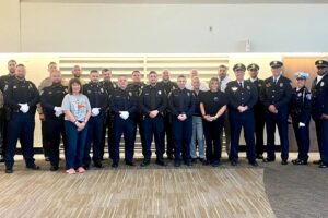 Cabot police and other central Arkansas officers at Clinton National Airport to welcome C.O.P.S. parents