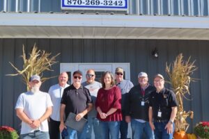 Group in front of the Foster Heating & Air sign at Customer Appreciation Day 2026 and BeanFest kickoff in Mountain View