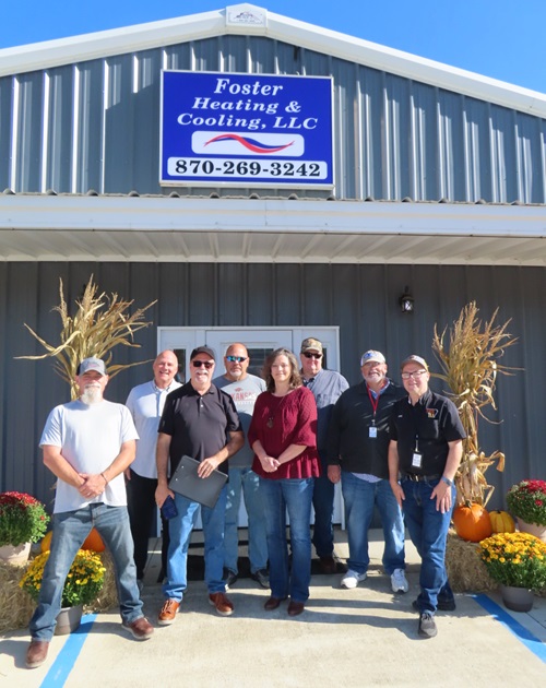 Group in front of the Foster Heating & Air sign at Customer Appreciation Day 2026 and BeanFest kickoff in Mountain View