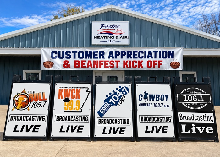 ArkansasRadio.com station Broadcasting Live signs in front of Foster Heating & Air in Mountain View Arkansas