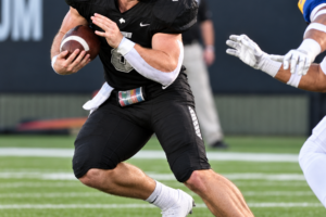 Harding University running back Andrew Miller carries the football