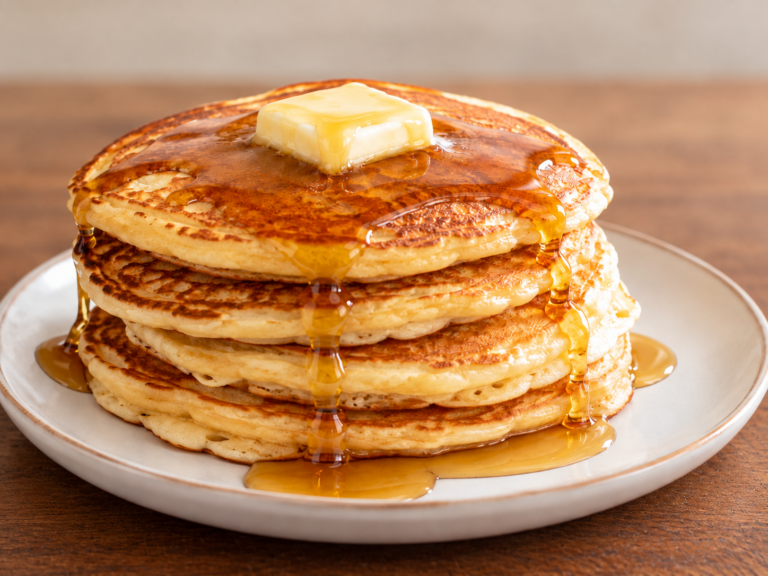 Stack of pancakes with butter and syrup for Chubby Menard Pancake Day in Batesville