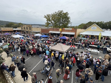 aLarge crowd fills downtown Mountain View Arkansas around the courthouse square during the 2026 Bean Fest