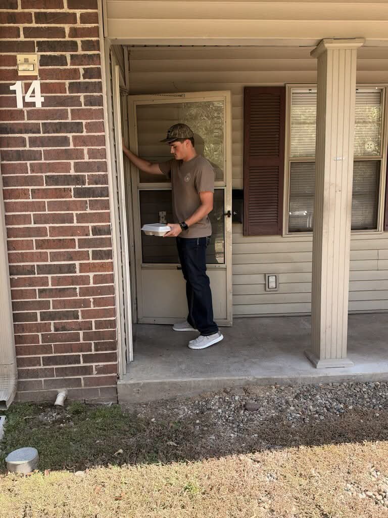 A Pangburn FBLA student delivering a meal to a local resident's door