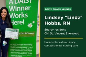 Searcy nurse Lindsey Lindz Hobbs RN holds her DAISY Award certificate and sculpture at CHI St. Vincent Sherwood