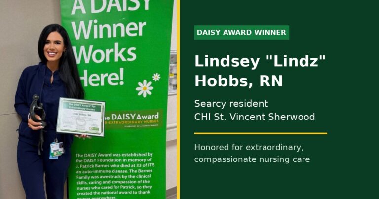 Searcy nurse Lindsey Lindz Hobbs RN holds her DAISY Award certificate and sculpture at CHI St. Vincent Sherwood